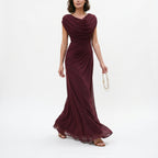 Burgundy maxi dress with draped cowl neckline and gathered waist, long flared hem.