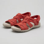 Red orthopedic sandals with contoured footbed and adjustable straps