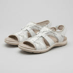 White orthopedic sandals with contoured footbed, front cutout straps