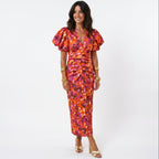 Midi dress with puff sleeves, V-neck, ruched waist; orange and yellow abstract floral print