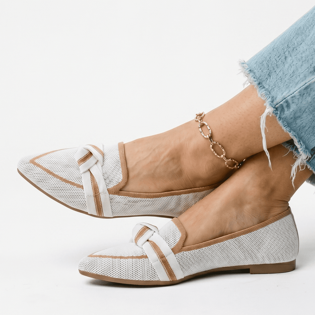 Women’s slip-on loafers in white with bow strap detail and pointed toe