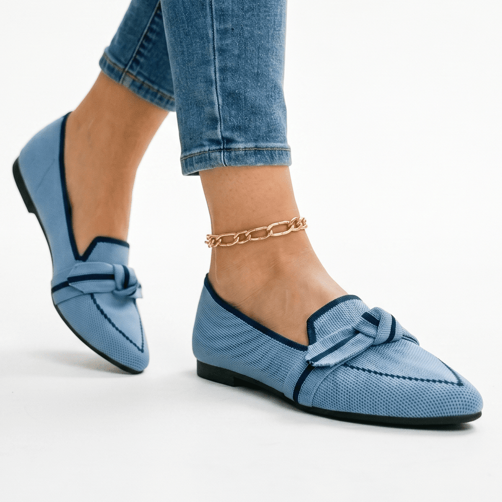 Women’s slip-on loafers in light blue with bow strap detail and pointed toe