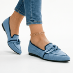 Women’s slip-on loafers in light blue with bow strap detail and pointed toe