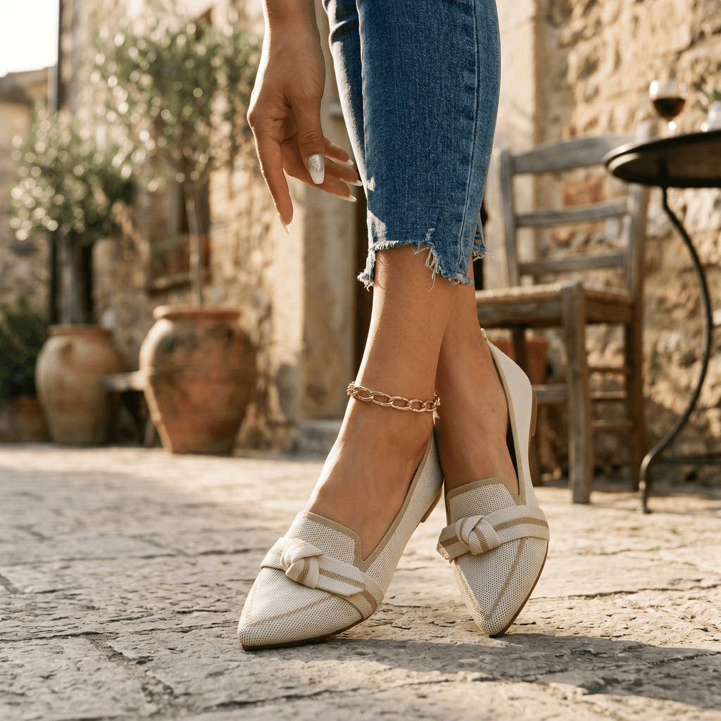 Women’s slip-on loafers in light beige/white with bow strap detail and pointed toe