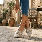 Women’s slip-on loafers in light beige/white with bow strap detail and pointed toe