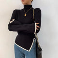 Black ribbed high-neck sweater with contrast white hem and slit