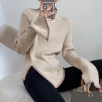 Light beige ribbed turtleneck sweater with contrast edge and side slit