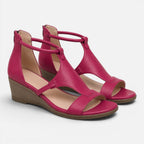 Pink wedge sandals with open toe and adjustable ankle strap