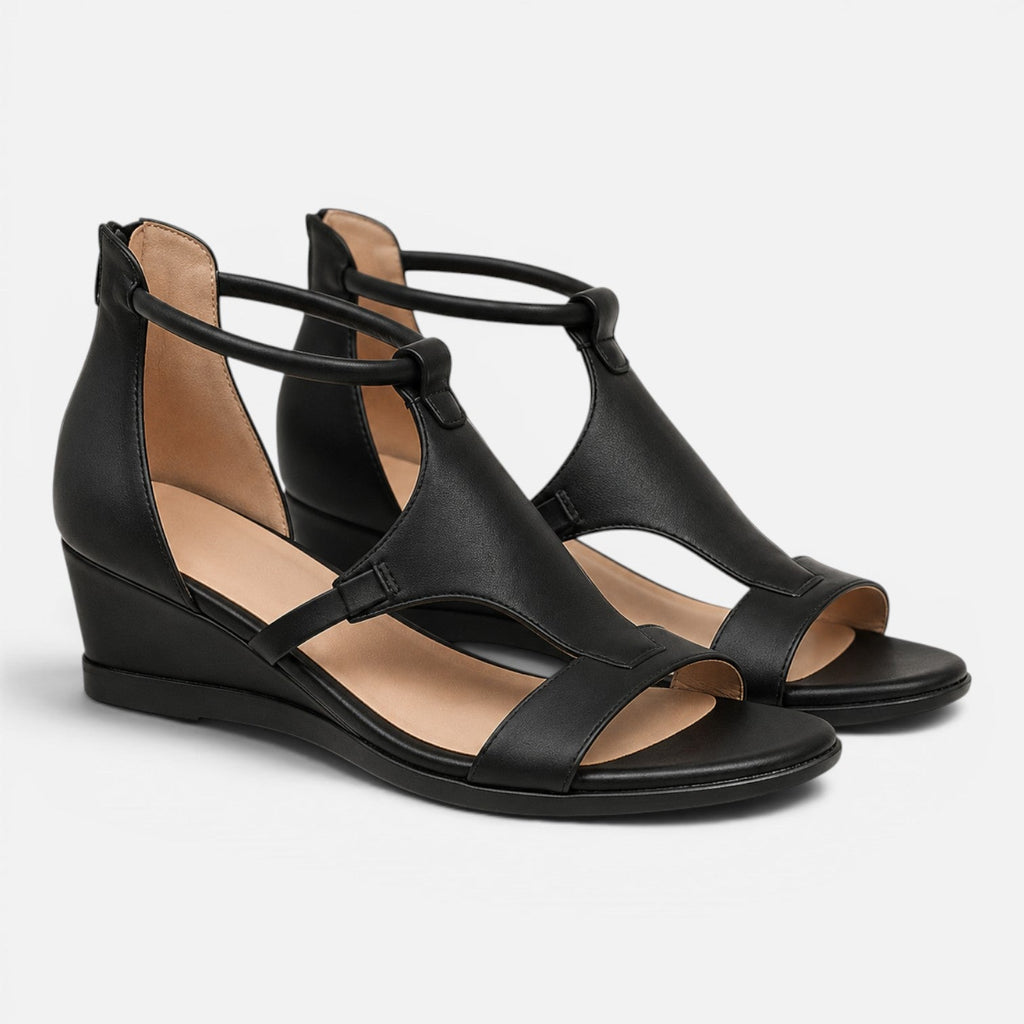 Black heeled wedge sandals with crisscross straps and open toe