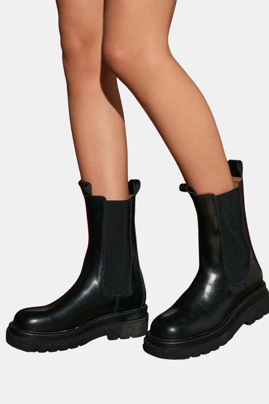Black platform Chelsea boots, ankle height with elastic gore and treaded sole
