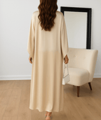 Satin maxi abaya dress with draped sleeves and cape-style back, cream