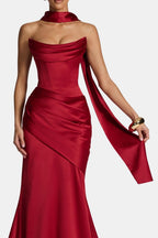 Deep red satin long scarf with long trailing ends, wrapped around the neck