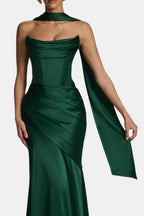 Emerald green satin long scarf with long trailing end, draped over the shoulder