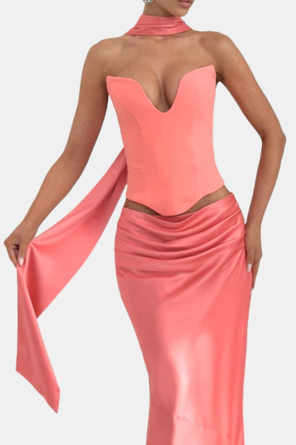 Coral pink satin long scarf with long trailing ends, styled over a sleeveless outfit