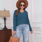 Teal blue V-neck lightweight tunic sweater with long sleeves and ribbed knit texture.