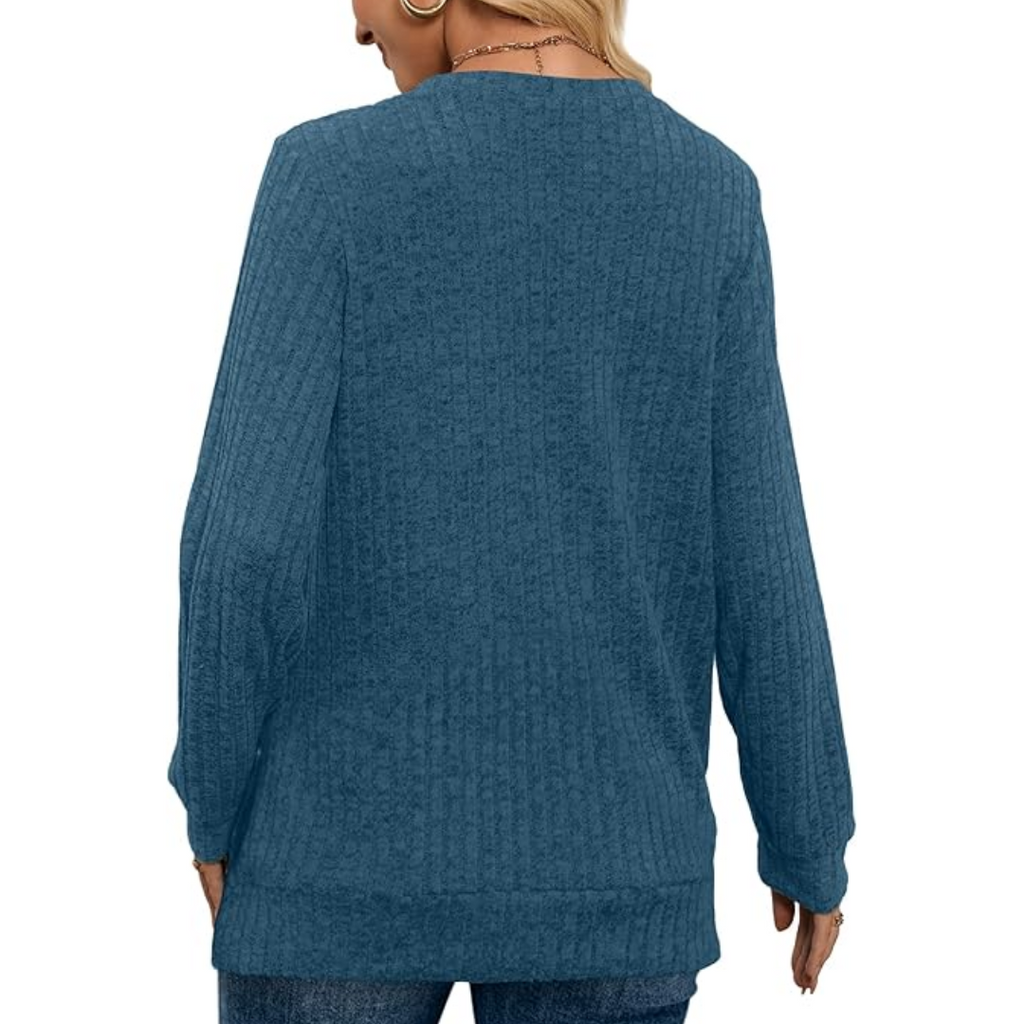 Back view of teal blue V-neck lightweight tunic sweater with long sleeves and knit texture.