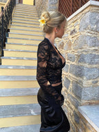 Black lace deep V crop top, long sheer sleeves, side profile