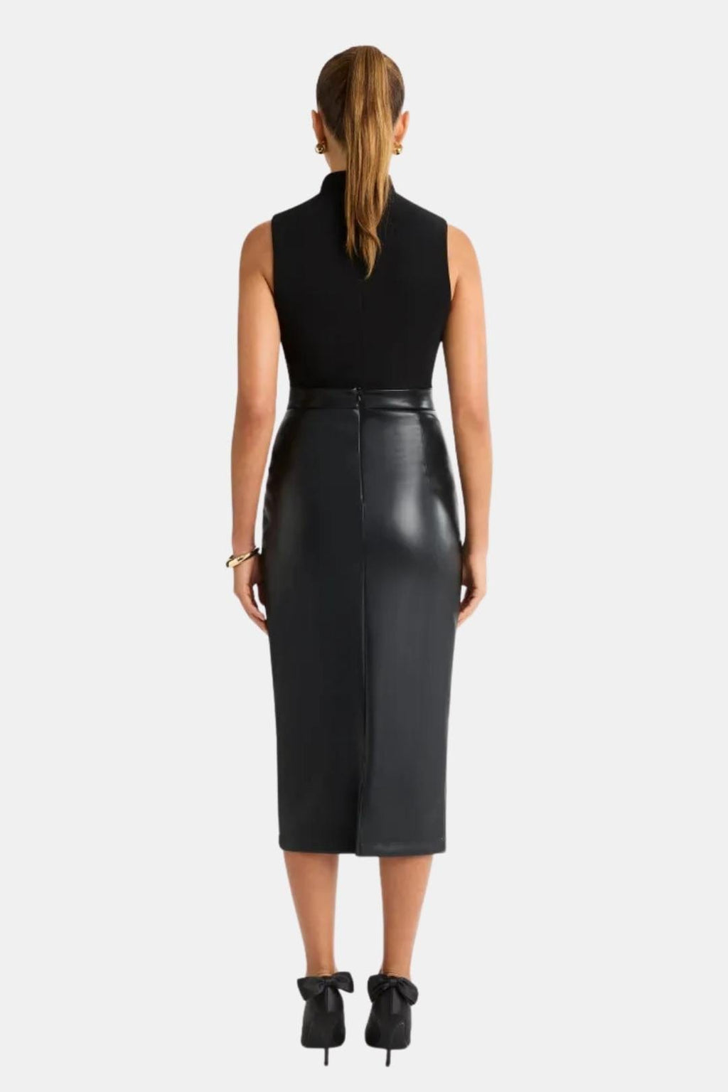 Black faux leather midi skirt with front center split and fitted waistband