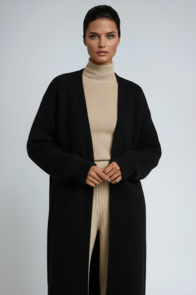 Long open-front cardigan coat in black over ribbed turtleneck sweater