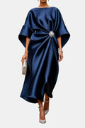 Midnight blue satin maxi dress, boat neck, wide sleeves, front twist with brooch