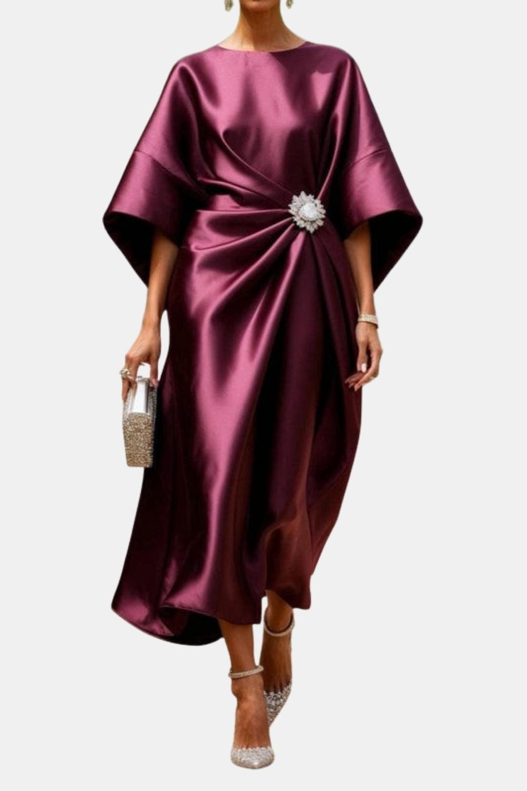 Claret satin maxi dress, boat neck, wide sleeves, front twist with jeweled brooch