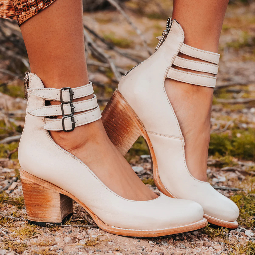 White women’s Mary Jane chunky heels with buckled ankle strap and block heel