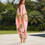 Pink kaftan-style dress with tropical animal and palm print, V-neck, flowing long hem