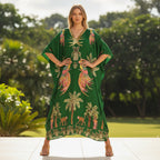 Green kaftan-style dress with tropical bird and palm print, V-neck, loose long silhouette