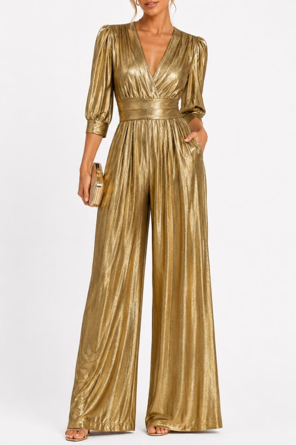 Gold V-neck jumpsuit with gathered waist, long puff sleeves, and flowing wide legs