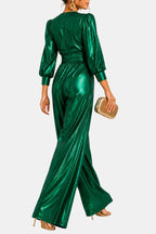 Green V-neck jumpsuit with ruched waist, puff sleeves, and wide-leg flared trousers