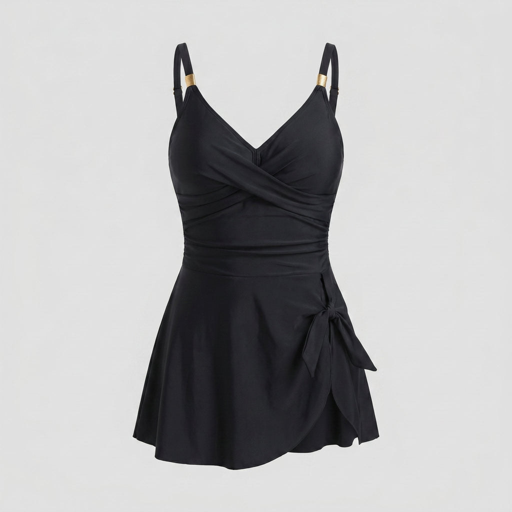 Black one-piece swimdress with surplice bust, ruched tummy control, tie-front skirt, straps
