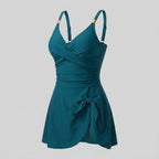 Peacock blue one-piece swimdress with surplice bust, ruched tummy control, tie-front skirt, straps
