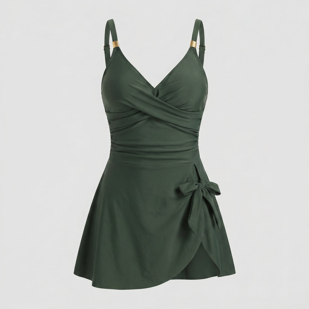 Dark green one-piece swimdress with surplice bust, ruched tummy control, tie-front skirt, straps