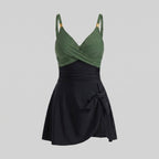 Black and dark green one-piece swimdress with surplice bust, ruched tummy control, tie-front skirt