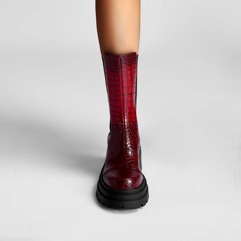 Dark red tall boots with black elastic side panels and chunky platform sole