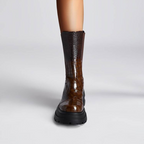 Brown platform boots with dark brown elastic side panels and thick lug-sole heel