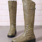 Knee-high olive boots with side buckle strap and stacked lug sole