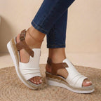 White and brown platform orthopedic sandals with buckled ankle strap and open toe