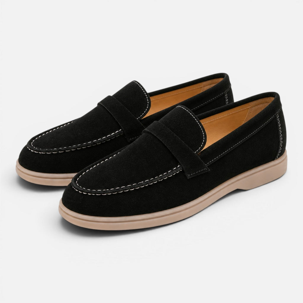Women's black suede slip-on loafers with strap detail and contrast stitching