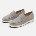 Women's gray suede slip-on loafers, moc-style stitching and low flat sole
