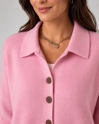 Pink collared knit cardigan with button placket and short sleeves