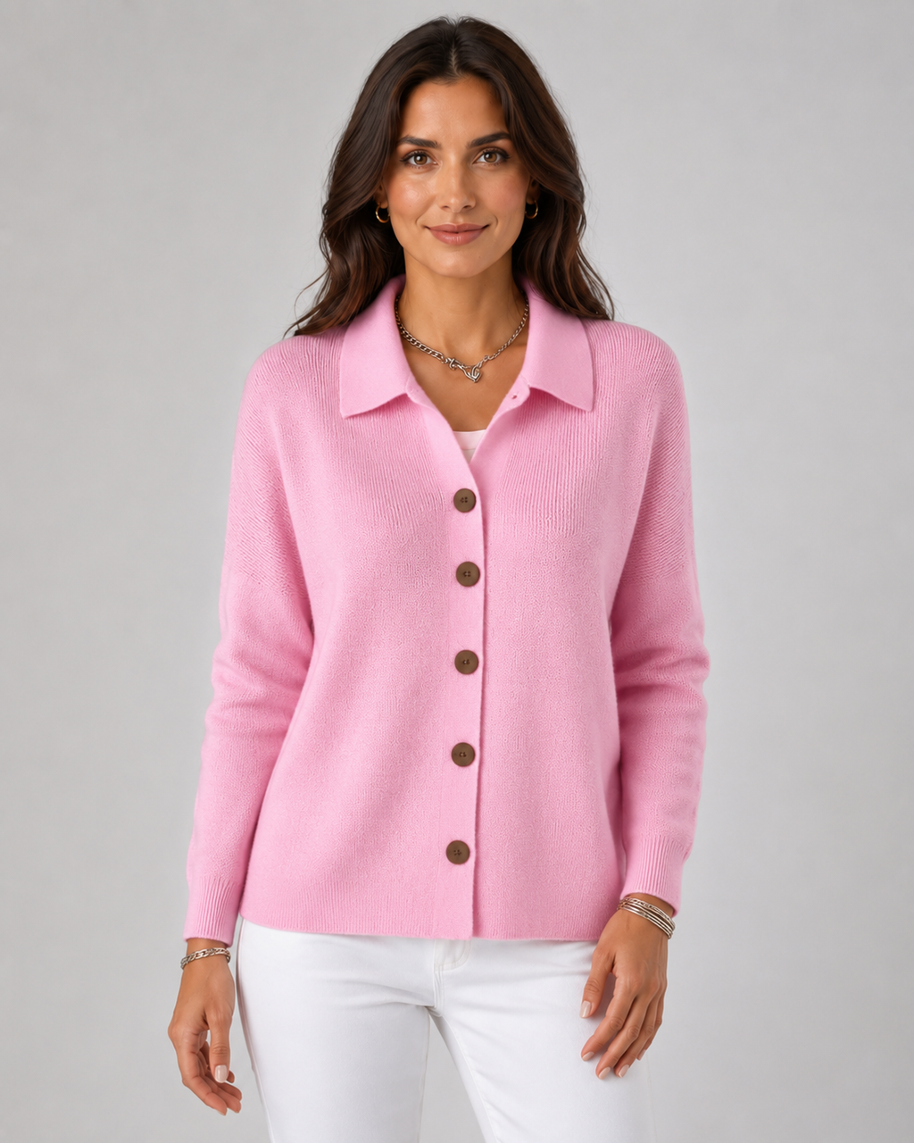 Pink collared button-up knit cardigan with long sleeves and dark buttons