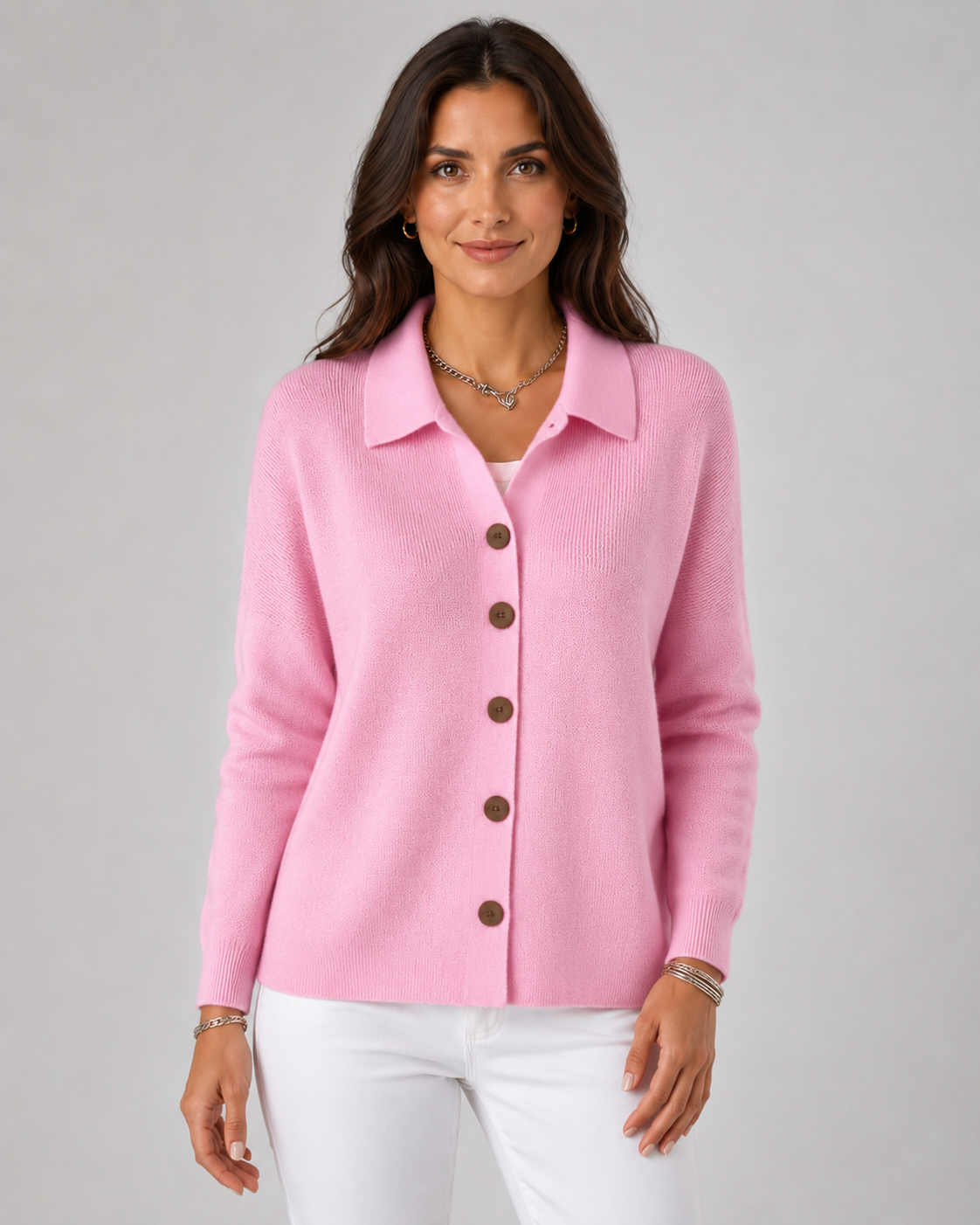 Pink collared button-up knit cardigan with long sleeves and dark buttons
