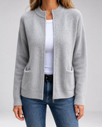 Gray open-front knit cardigan with long sleeves and front patch pockets