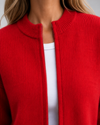 Red open-front knit cardigan with ribbed collar and visible zipper placket