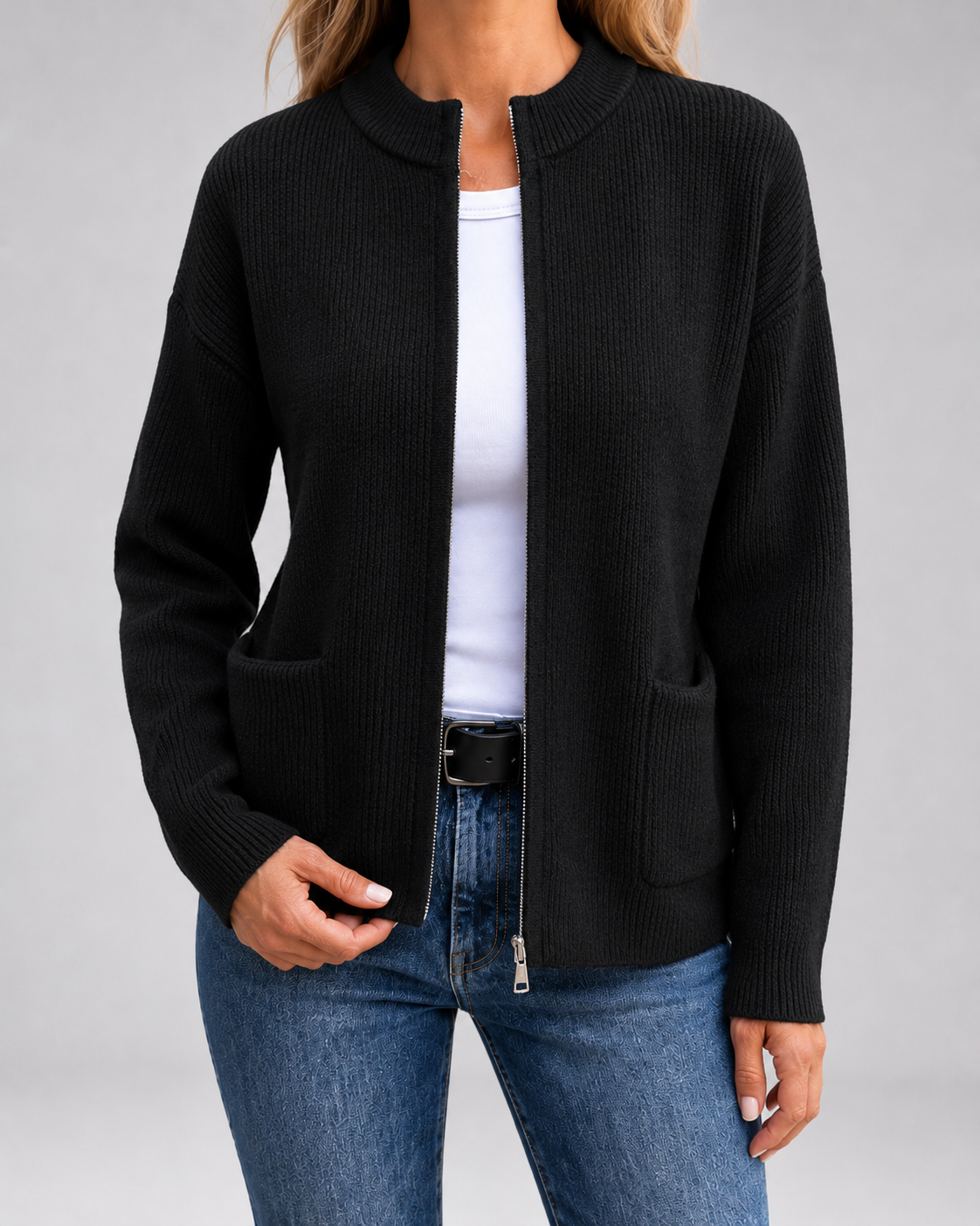 Black open-front knit cardigan with long sleeves, patch pockets, and zipper front