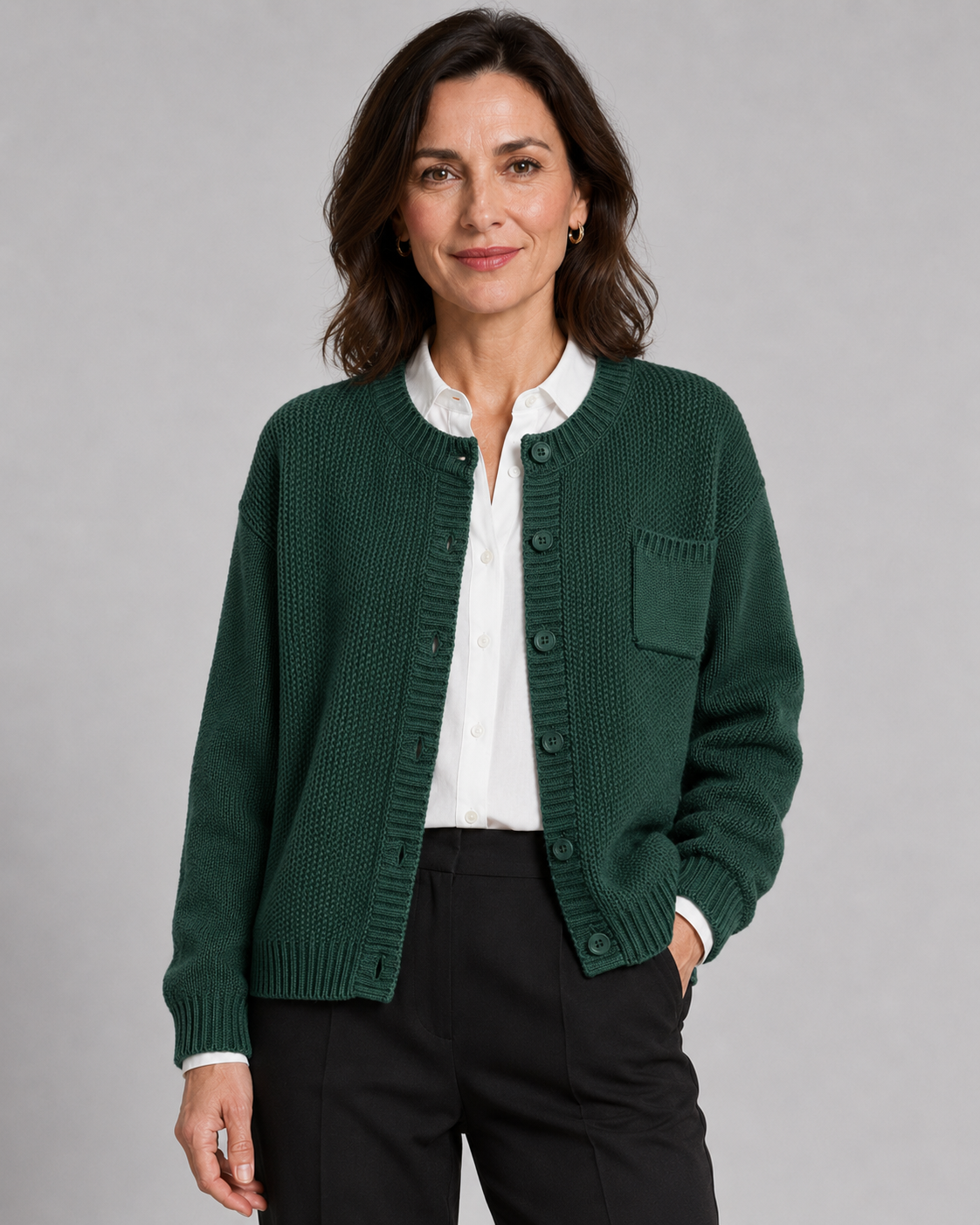 Green knit button-up cardigan with button front and side pockets