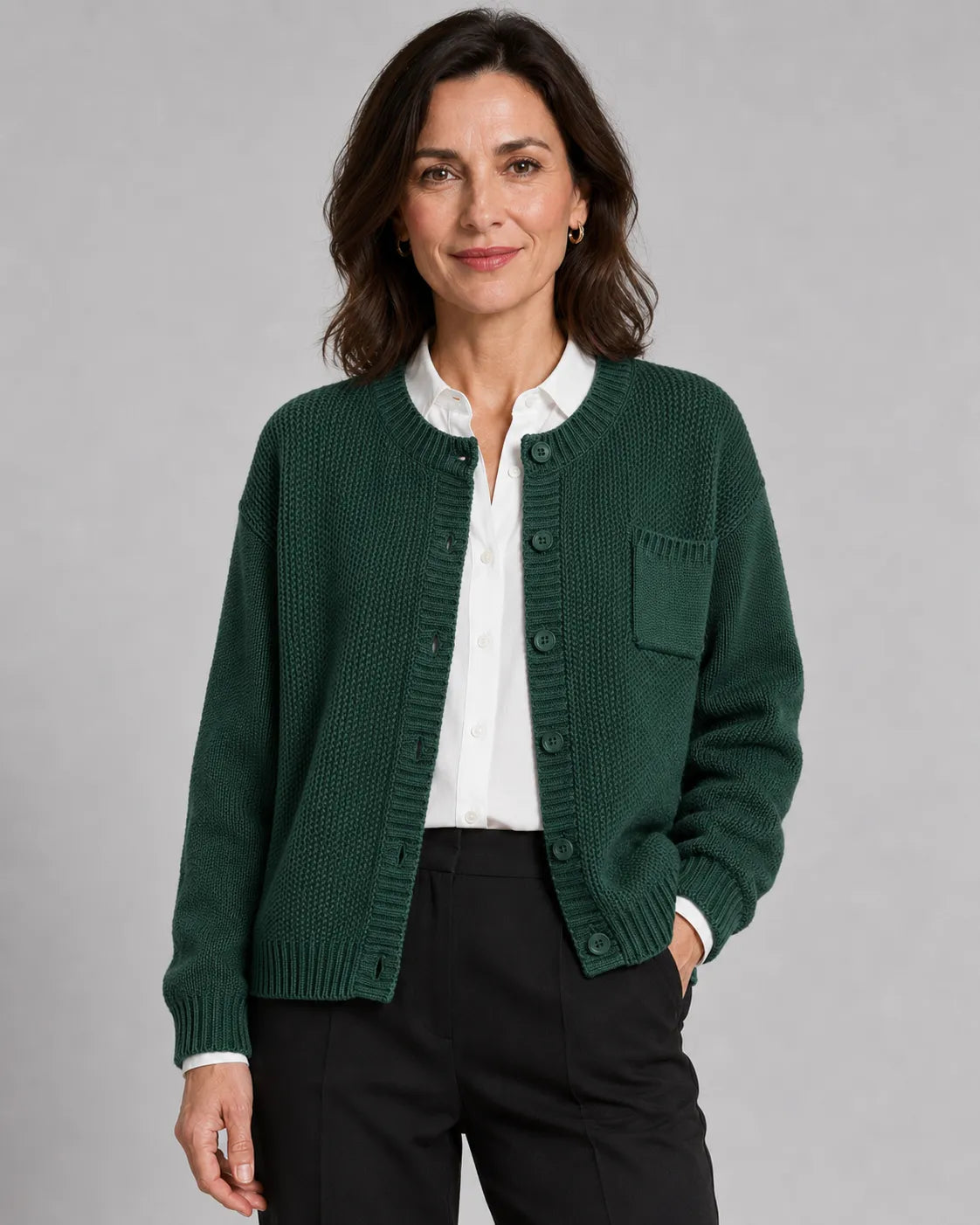 Green knit button-up cardigan with button front and side pockets