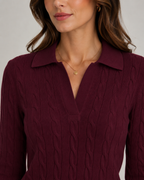 Burgundy cable knit polo sweater with ribbed collar and textured cable pattern