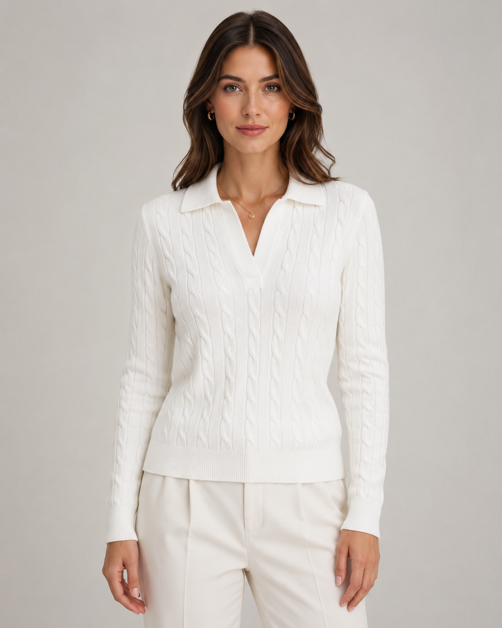 White cable knit polo sweater with V neckline and ribbed polo collar